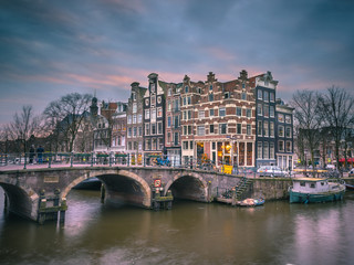 Canal houses sunset Amsterdam retro look