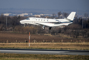 Fototapeta na wymiar Business private jet in low level flight