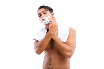 Fototapeta premium Handsome man shaving isolated on white