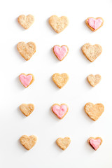Obraz na płótnie Canvas cookies for Valentine Day heartshaped white background top view pattern