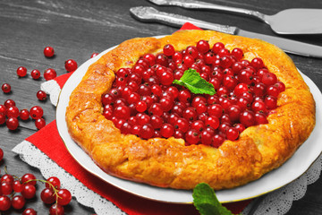 Open pies tart with berries red currant