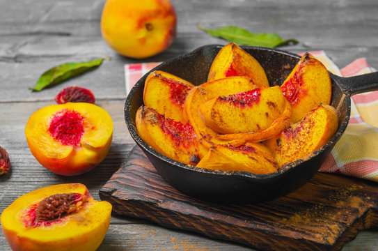 Baked peaches on a cast iron pan
