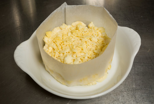 Mozzarella and cheddar cheese mixed pate, ready for making into macaroni and cheese.