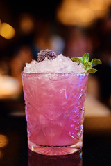 Pink cocktail at the bar in the restaurant