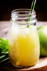 Freshly squeezed juice with celery, green apple and ice. Vintage