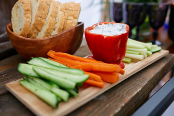 pepper and vegetables on a wooden board