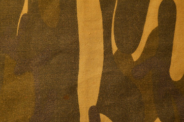 Textile khaki camouflage cloth texture. Closeup of military uniform surface. Background of green...