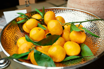 tangerines on a beautiful plate on a table in a restaurant
