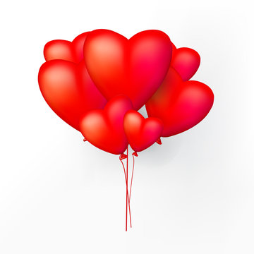 Red heart balloons on a white