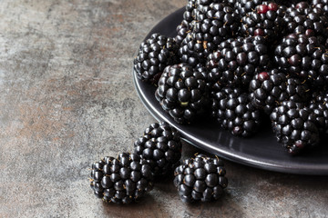 Fresh Blackberries on Black Plate over Slate