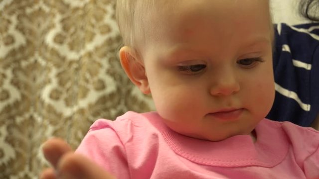 Happy Little Baby Girl Reading Electonic Book. 4K UltraHD video.
