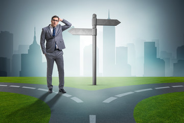 Businessman in difficult choice concept