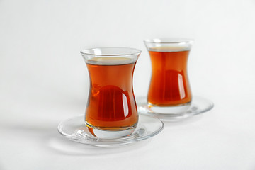 Turkish tea in traditional glasses isolated on white