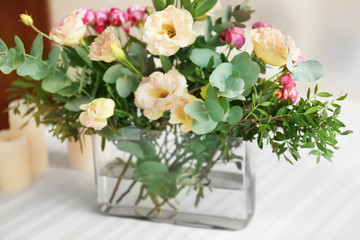 Naklejka na ściany i meble Flower arrangement on a white table