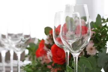 Elegant table setting with beautiful flowers, closeup