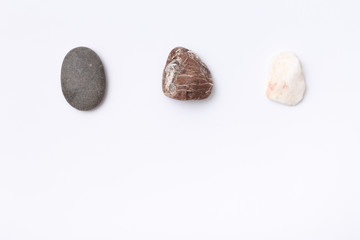 three stone, rock on white isolated paper