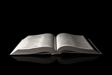 Holy Bible isolated on black background