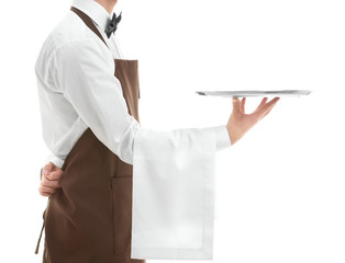 Waiter holding empty silver tray over white background