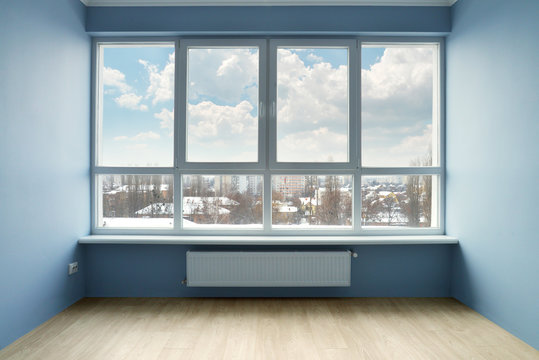 Empty room with large window