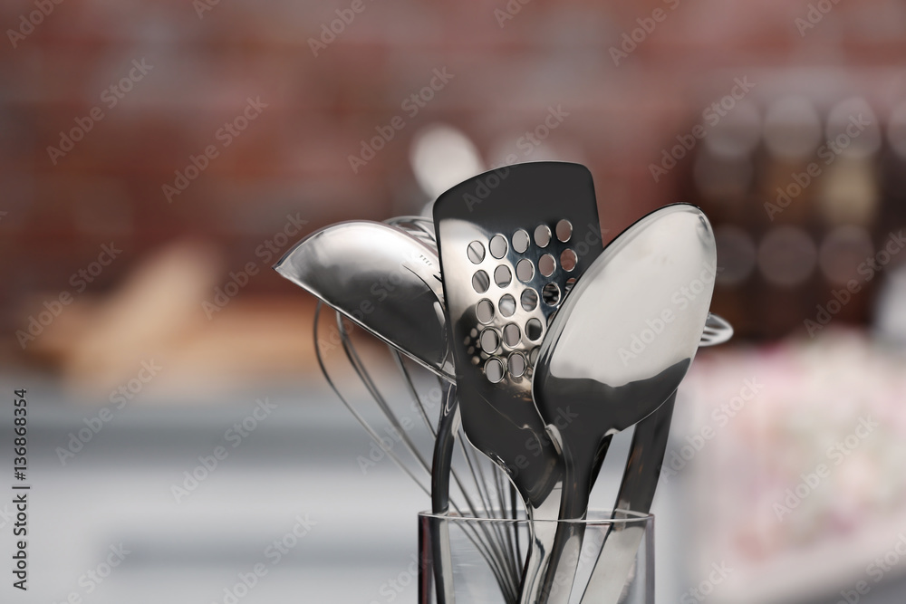 Canvas Prints Set of metal kitchen utensils in glass on blurred background