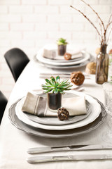 Table served with succulents for dinner in living room