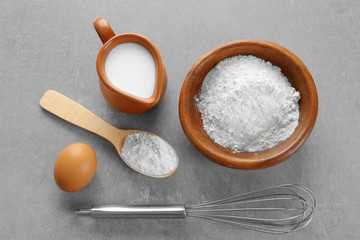 Fototapeta na wymiar Ingredients for dough on kitchen table