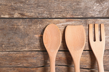 Kitchen utensils on wooden background
