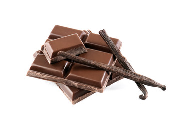 Chocolate pieces with vanilla pods, isolated on white