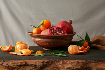 Composition of juicy fruits on wooden table