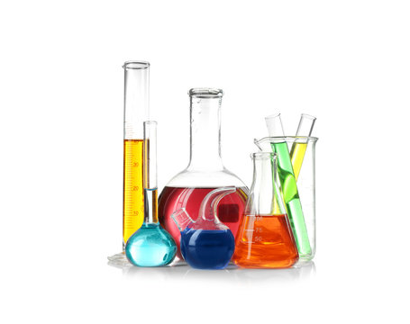 Laboratory glassware with samples on white background