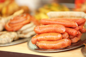 Tray with sausages on counter
