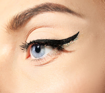 Female eye with elegant makeup, closeup