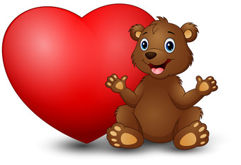 Cartoon funny bear sitting with a big heart