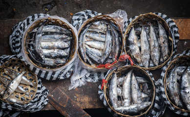 Fish Seller at the Ubud, Bali, Traditional Public Market.  Colorful fish and vegetables can be purchased at the Ubud, Bali public market in the cultural heart of this fantastic Indonesian island.