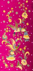 Obraz na płótnie Canvas Beautiful pattern batik on red background