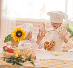 happy little children in the form of a chef to prepare delicious