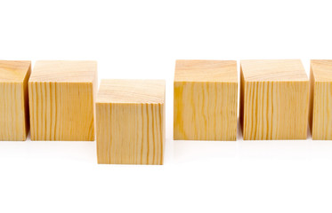 Stepping forward or outstanding concept - row of wood blocks