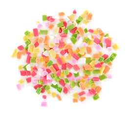 Sugar sprinkles on top of icing birthday cake.