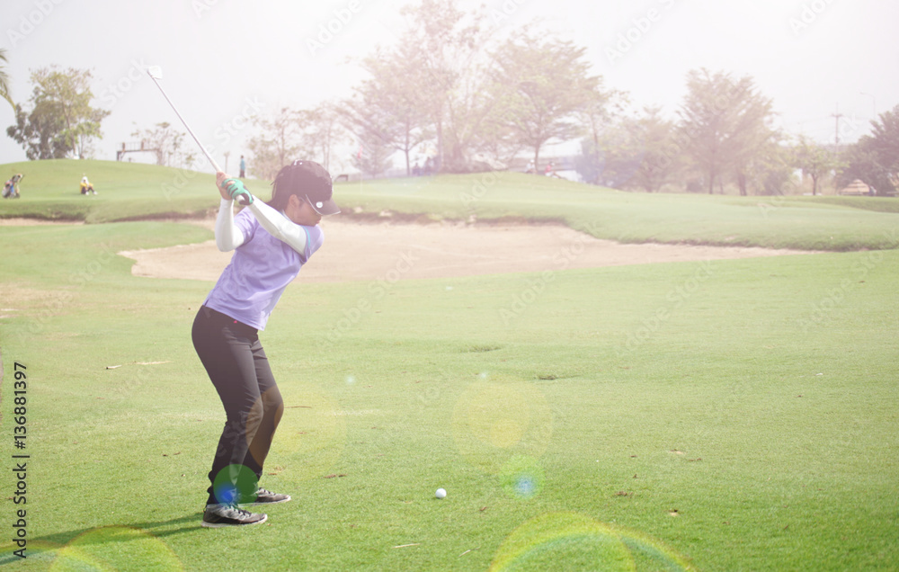 Wall mural Women's golf is a sport that requires endurance.