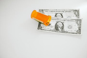 Money prescription medication pills and stethoscope medical, the cost of health care in america