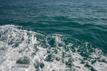 blue sea stormy waves with white foam