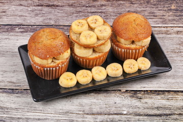 Homemade banana cakes topped sliced banana.