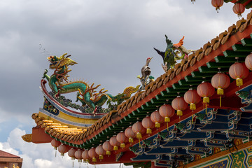 Dragon and Crane Sculpture on Chinese Temple Roof