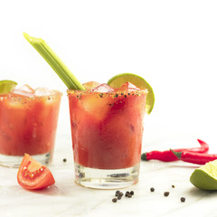 Bloody Mary cocktails with celery and lime