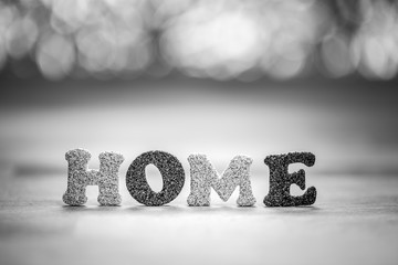 The word HOME on white background; Family and love concept.