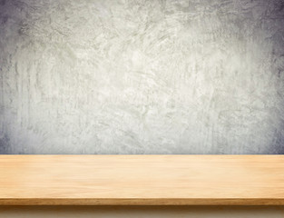 Wood table top with grunge concrete wall,Mock up template for di