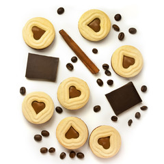 Pieces of chocolate, cocoa cookies, coffee beans and cinnamon st