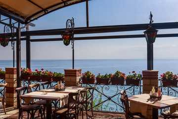 The interior of the restaurant overlooking the sea