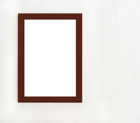 Dark wooden frame for picture hanging on white wall
