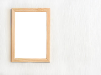 Light  wooden frame for picture hanging on white wall